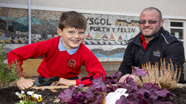 Bryson recycling supply Ysgol Porth y Felin, Conwy with free compost to help them grow their own herbs, Vegetables and plants; Pictured John Franks -team Leader Bryson Recycling and Ysgol Porth y Felin pupil and member of the school cancel .       Picture Mandy Jones