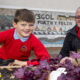 Bryson recycling supply Ysgol Porth y Felin, Conwy with free compost to help them grow their own herbs, Vegetables and plants; Pictured John Franks -team Leader Bryson Recycling and Ysgol Porth y Felin pupil and member of the school cancel .       Picture Mandy Jones
